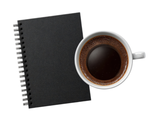 Dark-colored spiral-bound notebook beside a cup of coffee