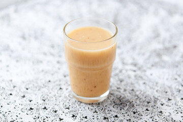 Pineapple coconut smoothie on bright background. Soft focus. Copy space.	