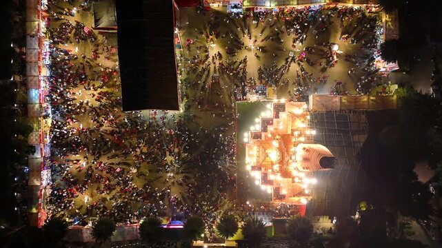 Aerial view of durga pooja event with temple  people gathering 