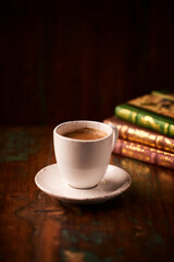 Cup of coffee on wooden background. Soft focus. Copy space	