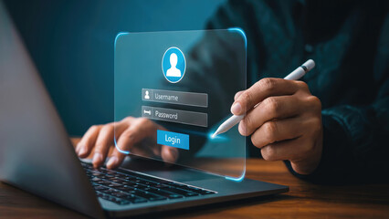 User logging in to laptop with username and password, securing online access
