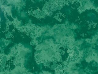 Lush green marble surface with complex patterns and a mix of dark and light tones.