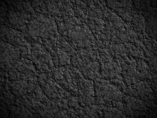 Dark textured black rock with subtle rough patterns, perfect for background use.