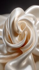 Creamy off-white satin fabric swirled into a rose-like form