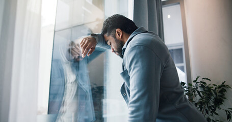 Anxiety, businessman and window with stress for bankruptcy, company liquidation or financial crisis...