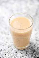 Pineapple coconut smoothie on bright background. Soft focus. Copy space.	