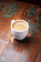 Cup of coffee on wooden background. Soft focus. Copy space	