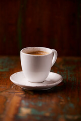 Cup of coffee on wooden background. Soft focus. Copy space	