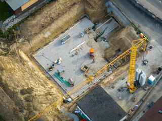 Aerial view of construction site in Switzerland. Crane for building a new house.