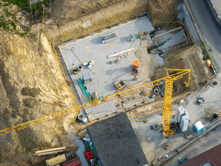 Aerial view of construction site in Switzerland. Crane for building a new house.