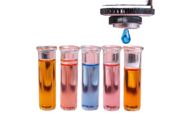 Droplet of liquid dispensed into test tubes of various colored liquids