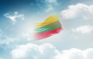 Lithuania flag waving light background hidden in the sky.