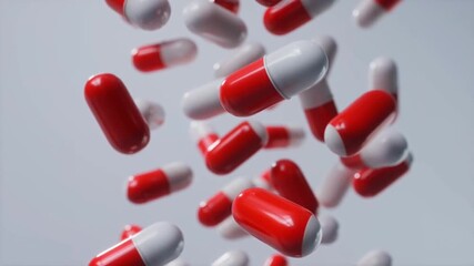 White and red capsules falling in slow motion against light neutral background captured in cinematic macro shot. Concept of pharmaceuticals and modern medicine - Powered by Adobe