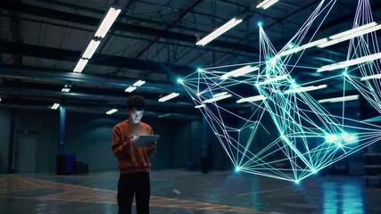 Worker in warehouse using tablet with holographic connected supply chain network. - Powered by Adobe