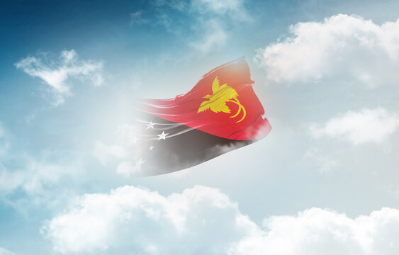 Papua New Guinea flag waving light background hidden in the sky.