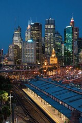 Naklejka premium City skyline at dusk, train station