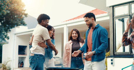 Group, people and grill for BBQ outdoor to start fire, new years party and social gathering. Friends, hug and prepare barbecue for lunch reunion, setup flame and bonding activity in backyard at house