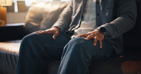 Hands, nervous and therapy with person on sofa in office for consulting or counselling appointment. Anxiety, mental health or stress with trauma patient in session for advice, healing or psychology