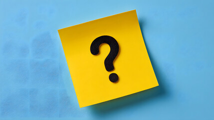 Yellow sticky note with question mark on blue background