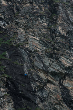 man climbing a via ferrata at Moiry Dam Switzerland