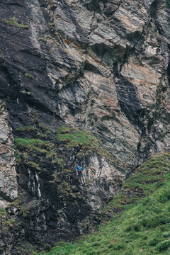 man climbing a via ferrata at Moiry Dam Switzerland