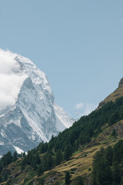 person paragliding next to the Matterhorn mountain in Switzerland