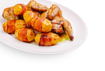Delicious roasted chicken with bacon-wrapped potatoes served on a platter