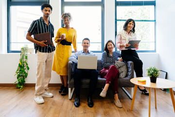 Startup business team posing in modern office