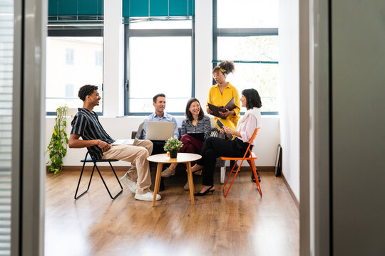 Business people collaborating during meeting in modern office