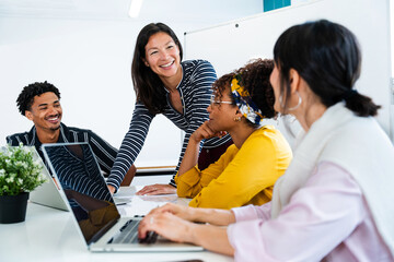 Business people collaborating on project in startup office meeting