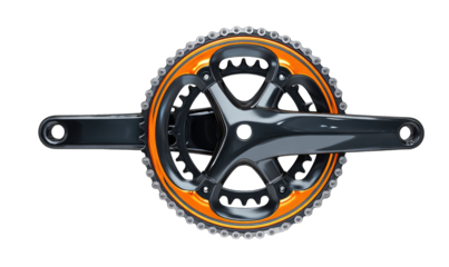 High-angle view of a dark bicycle crankset with orange accents