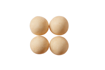 Four pale beige round candies arranged in a square