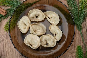 Mushroom dumplings on a plate close-up, Christmas Eve