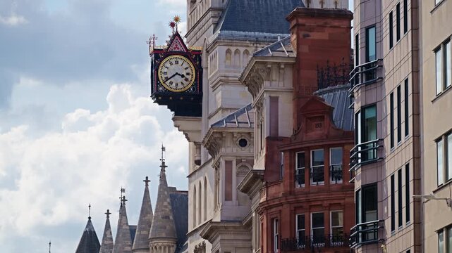 Street view of the clock tower and of the Royal Courts of Justice in London, England