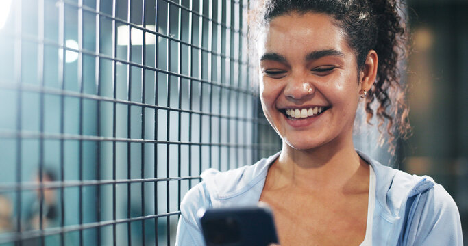 Sport, woman and happy with phone at tennis court for practice break, texting and internet browsing. Athlete, night and smile with smartphone at padel club for reading notifications and social media