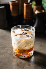 A delicious layered drink of coffee, cream, and sweetness, served artfully