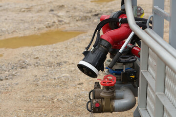 Obraz premium Fire extinguishing equipment, nozzles and hoses are ready in case of fire.