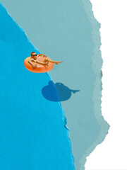 Minimalist pop art collage. Boy floating in orange tube above torn blue paper water. Concept of relaxation, carefree summer, childhood fun, swimming leisure and holiday happiness.