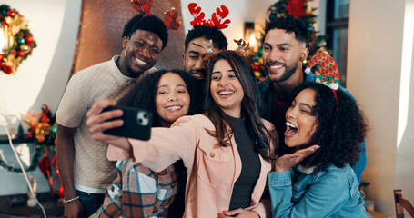 Smile, group and friends with selfie for Christmas celebration, festive reunion and social media post. Holiday, people and photography for bonding with xmas, profile picture and memory at house