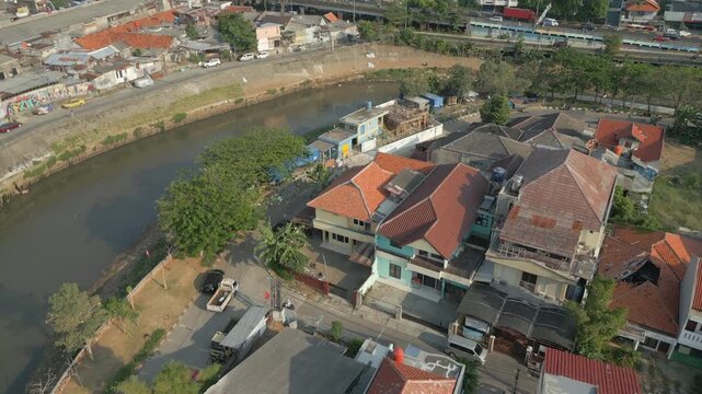 Canal Curves Past Edge Of Tebet Neighborhood Jakarta Indonesia 4K 60FPS