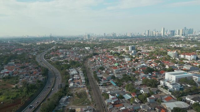 Bintaro Neighborhood And Jakarta City In Distance Drone Track Back 4K 60FPS
