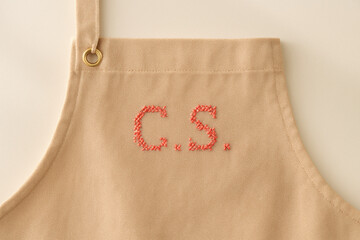 Beige Apron with Cross-Stitch Initials
