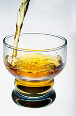 whiskey pouring into glass