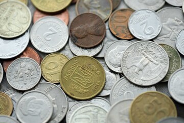Big pile of different coins from various currencies and different countries around the world. Currency exchange