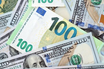 Big pile of Euro and USD banknotes. Many european and united states dollars