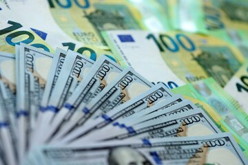 Big pile of Euro and USD banknotes. Many european and united states dollars