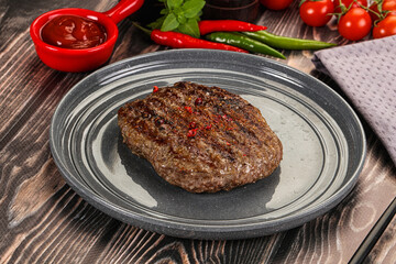 Grilled beef burger cutlet with sauce