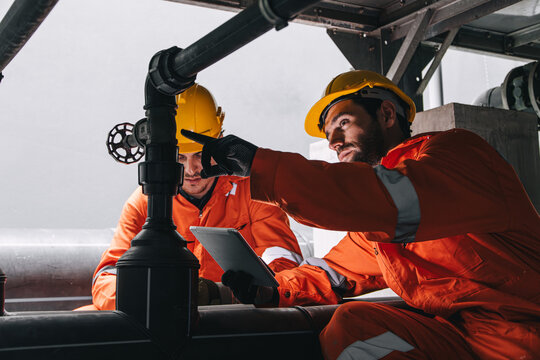 Two professional engineer male teamwork service maintenance, Worker industry water pipe tube system