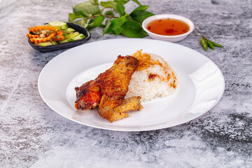 Spicy roasted chicken wing with rice