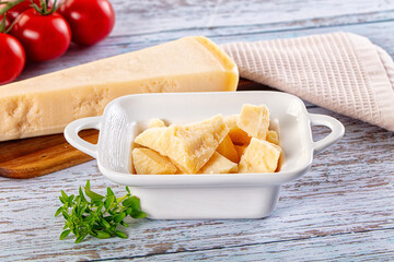 Parmesan cheese pieces in the bowl